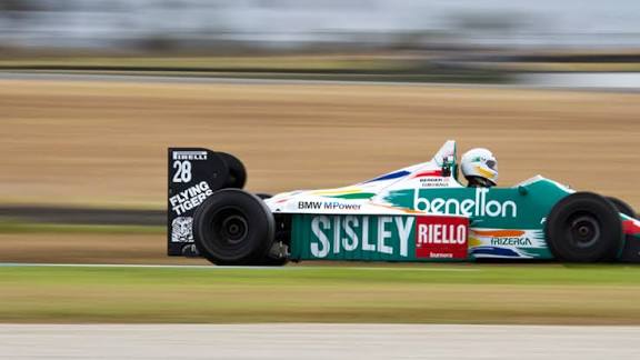 Historic Benetton Formula One car on track